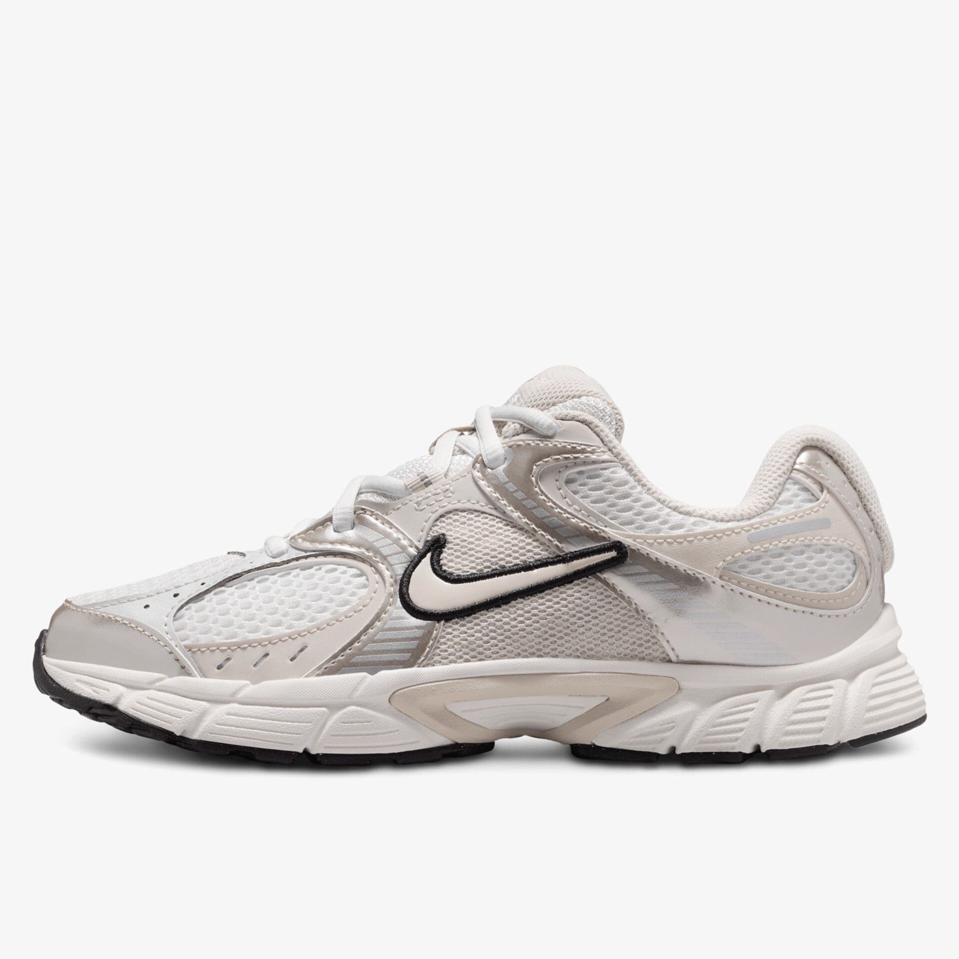 A beige and white athletic sneaker with a black swoosh logo, mesh panels, and a textured sole, displayed on a plain white background.