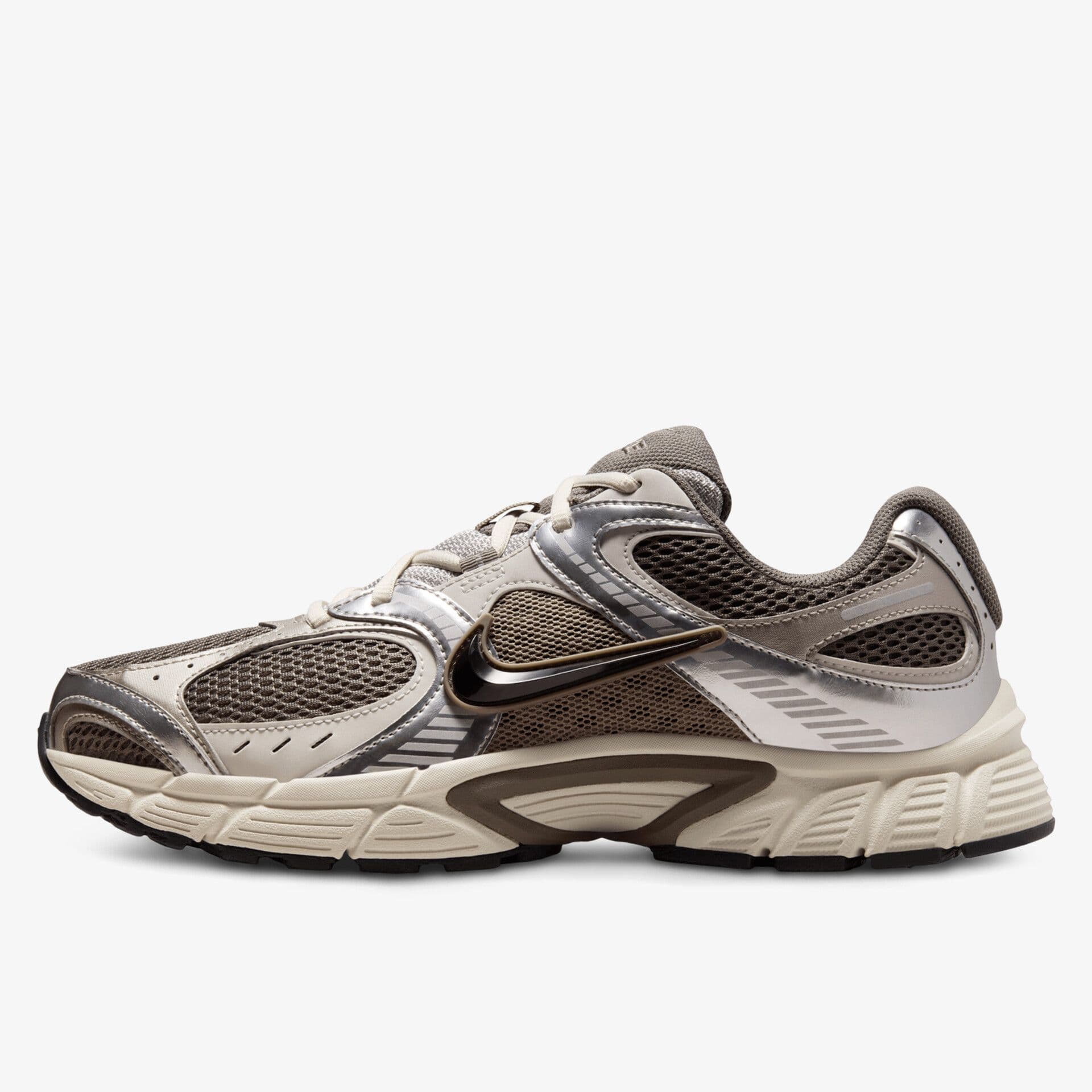 A stylish sneaker with beige, brown, and metallic silver accents, featuring mesh panels and a prominent swoosh logo on the side.