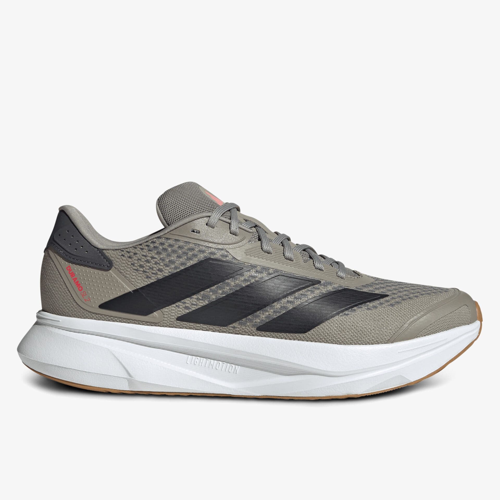 Gray athletic shoe with black stripes, featuring a cushioned white sole and subtle red accents. Designed for comfort and performance.