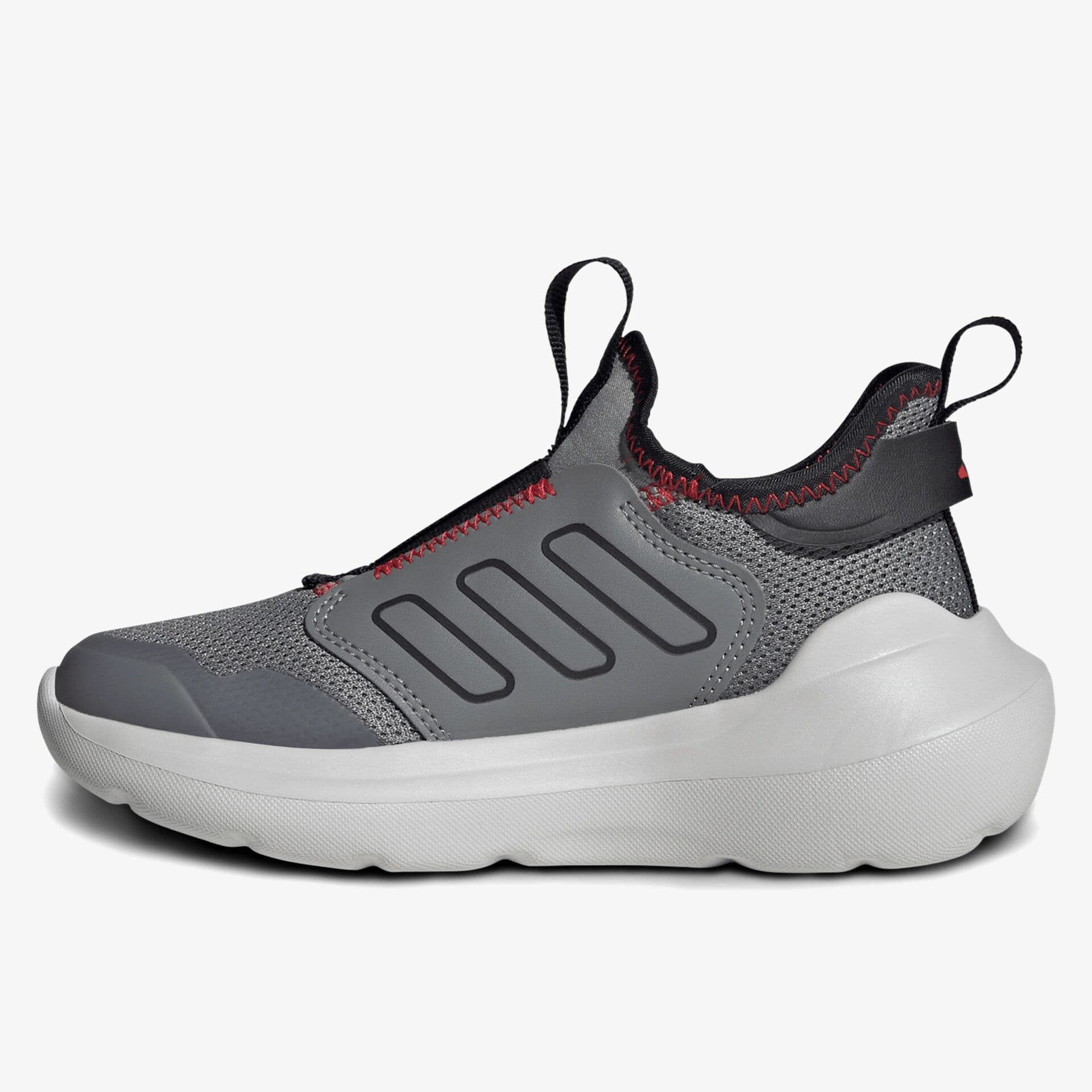 Gray athletic shoe with a mesh upper, black stripes, and red stitching. Features a pull tab on the heel and a thick white sole.